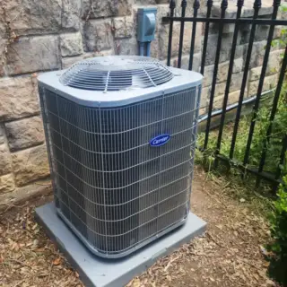 Carrier condenser unit installed outside a customer's house.