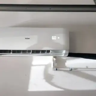 Haier mini-split unit installed in a garage.