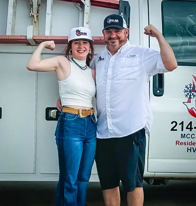 Keith McClain and his daughter show off the strength of McClain Heating & Air!